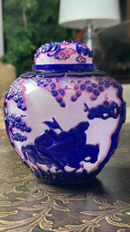 CHINA, QING DYNASTY Qianlong Period (1736–1795) A Snowflake-Ground Pale Violet Overlay Beijing Glass Jar and Cover
