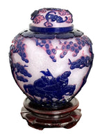 CHINA, QING DYNASTY Qianlong Period (1736–1795) A Snowflake-Ground Pale Violet Overlay Beijing Glass Jar and Cover